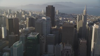 DFKSF13_015 - 5K aerial stock footage of approaching skyscrapers and tilting to a group of them in Downtown San Francisco, California