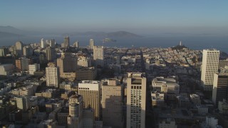 DFKSF13_025 - 5K aerial stock footage of flying over Stockton Street with view of Mark Hopkins Hotel, Alcatraz in Nob Hill, San Francisco, California
