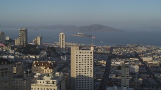 DFKSF13_026 - 5K aerial stock footage flyby Russian Hill apartment buildings with Alcatraz in distance, San Francisco, California