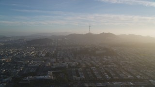 DFKSF13_040 - 5K aerial stock footage of approaching Sutro Tower, shrouded in haze in San Francisco, California