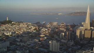 DFKSF13_057 - 5K aerial stock footage pan from Coit Tower and Treasure Island to Transamerica Pyramid in Downtown San Francisco, California