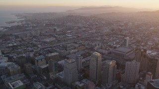 DFKSF14_009 - 5K aerial stock footage pan from South of Market to San Francisco Marriott Marquis hotel, Downtown San Francisco, sunset