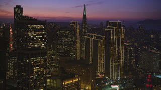 DFKSF14_070 - 5K aerial stock footage pan across skyscrapers near Transamerica Pyramid in Downtown San Francisco, California, twilight