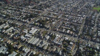 DFKSF15_001 - 5K aerial stock footage of a reverse view of suburban neighborhoods, Alameda, California