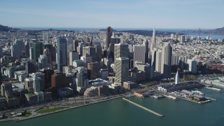 DFKSF15_008 - 5K aerial stock footage of approaching waterfront skyscrapers and the Ferry Building in Downtown San Francisco, California