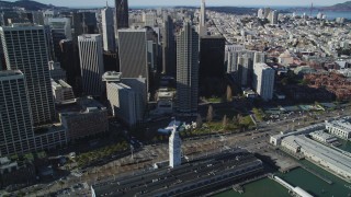 DFKSF15_012 - 5K aerial stock footage of tilting from skyscrapers to the Ferry Building in Downtown San Francisco, California