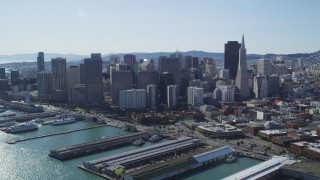 DFKSF15_015 - 5K aerial stock footage flyby Transamerica Pyramid and city skyscrapers in Downtown San Francisco, California