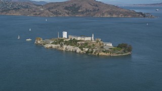 DFKSF15_019 - 5K aerial stock footage of flying by Alcatraz island prison, San Francisco, California