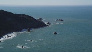 DFKSF15_038 - 5K aerial stock footage of flying by coastal cliffs while approaching Seal Rocks, San Francisco, California