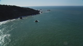 DFKSF15_039 - 5K aerial stock footage of tilting from San Francisco Bay, reveal Seal Rocks rock formations, San Francisco, California