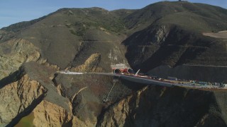 DFKSF15_059 - 5K aerial stock footage of flying by Highway 1 along coast and a tunnel under construction, Pacifica, California