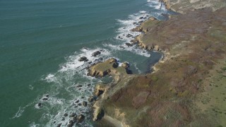 DFKSF15_099 - 5K aerial stock footage of a reverse view of the rugged coast, Pescadero, California