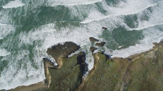 DFKSF15_101 - 5K aerial stock footage of a reverse view of ocean waves, revealing the coast, Pescadero, California