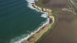 DFKSF15_116 - 5K aerial stock footage of a reverse view of coastal beaches, Davenport, California