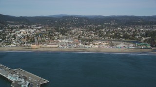 DFKSF15_129 - 5K aerial stock footage of flying by the Santa Cruz Beach Boardwalk, Santa Cruz, California