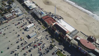DFKSF15_135 - 5K aerial stock footage of flying by the beach and rides at Santa Cruz Beach Boardwalk, Santa Cruz, California