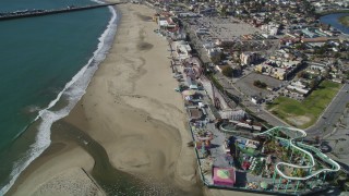 DFKSF15_137 - 5K aerial stock footage of orbiting the beach and rides at the Santa Cruz Beach Boardwalk, Santa Cruz, California