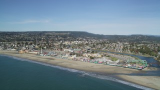 DFKSF15_138 - 5K aerial stock footage of flying away from Santa Cruz Beach Boardwalk and coast, Santa Cruz, California