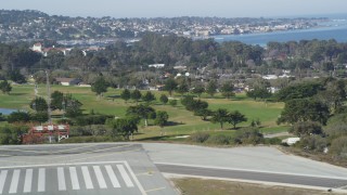 DFKSF15_157 - 5K aerial stock footage tilt from golf course to reveal the coastal community of Monterey, California