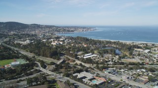 DFKSF16_002 - 5K aerial stock footage tilt from golf course to reveal coastal neighborhoods on the Monterey Peninsula, Monterey, California