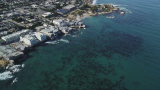 DFKSF16_007 - 5K aerial stock footage tilt from kelp to reveal coastal neighborhoods and Monterey Bay Aquarium, Monterey, California