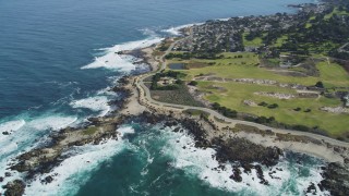 DFKSF16_012 - 5K aerial stock footage tilt from coast to reveal Point Pinos Lighthouse Reservation, Monterey, California