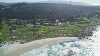 DFKSF16_015 - 5K aerial stock footage of flying by a coastal resort and golf course, Pebble Beach, California