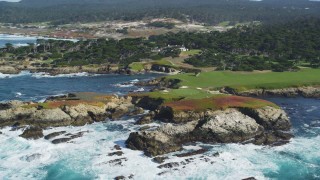 DFKSF16_022 - 5K stock footage aerial video of flying by the coastline around Cypress Point Golf Course in Pebble Beach, California