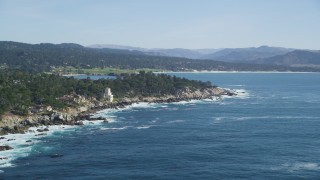 DFKSF16_024 - 5K aerial stock footage of flying by oceanfront mansions on the coast in Pebble Beach, California