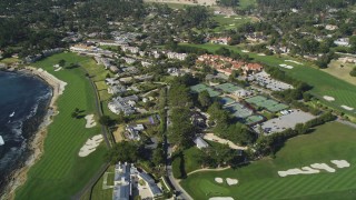 DFKSF16_030 - 5K aerial stock footage of Pebble Beach Resorts hotel, tennis courts, and Pebble Beach Golf Links, Pebble Beach, California