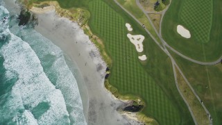 DFKSF16_035 - 5K aerial stock footage of a bird's eye view of a beachfront golf course in Pebble Beach, California