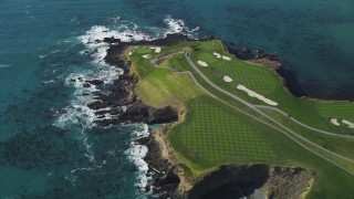 DFKSF16_037 - 5K aerial stock footage of flying over Pebble Beach Golf Links golf course and Carmel Bay, Pebble Beach, California
