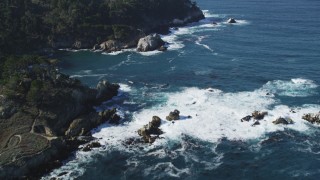 DFKSF16_044 - 5K aerial stock footage of tilting from the coves along the coast to reveal coastal cliffs, Carmel, California