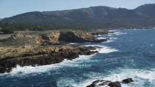 DFKSF16_046 - 5K aerial stock footage of passing coastal cliffs in Carmel, California