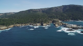 DFKSF16_047 - 5K aerial stock footage of flying by rugged coastline with trees and rock formations, Carmel, California