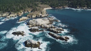 DFKSF16_048 - 5K aerial stock footage of flying by coastal rock formations, Carmel, California