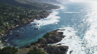 DFKSF16_050 - 5K aerial stock footage of panning to oceanfront homes and a cove on the coast, Carmel, California