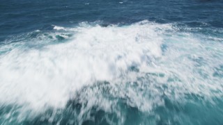 DFKSF16_055 - 5K aerial stock footage of tilting from ocean waves  to reveal coastal rock formations, Carmel, California