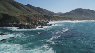 DFKSF16_061 - 5K aerial stock footage pan across coastal rock formations and beach, Carmel, California