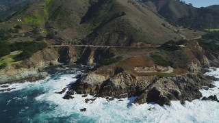 DFKSF16_065 - 5K aerial stock footage of flying by the Highway 1 coastal road winding around the coastline, Carmel, California