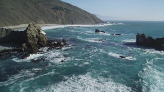 DFKSF16_102 - 5K stock footage aerial video of flying low over coastal rock formations near cliffs, Big Sur, California