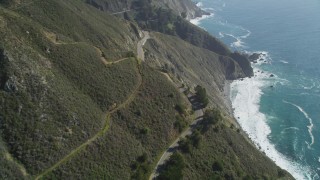 DFKSF16_115 - 5K stock footage aerial video of flying over the Highway 1 coastal road and cliffs, Big Sur, California
