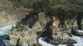 DFKSF16_123 - 5K aerial stock footage of tilting from the ocean to reveal McWay Falls, Big Sur, California