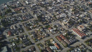 DFKSF16_157 - 5K aerial stock footage of a reverse view of suburban neighborhoods in Morro Bay, California