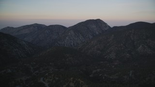 DFKSF17_047 - 5K aerial stock footage of flying by mountains, Los Padres National Forest, California, twilight