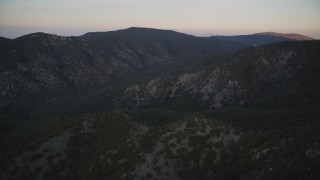 DFKSF17_048 - 5K aerial stock footage of flying by mountain ridges, Los Padres National Forest, California, twilight