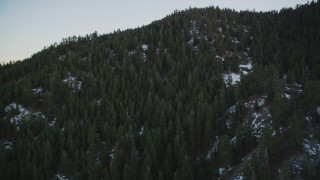 DFKSF17_050 - 5K aerial stock footage fly over patches of snow and forest in the mountains, Los Padres National Forest, California, sunset