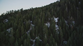 DFKSF17_051 - 5K aerial stock footage of flying over patches of snow and mountain in the Los Padres National Forest, California, twilight