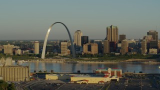 DX0001_000512 - 5.7K aerial stock footage of The Arch and skyline, passing by a casino by the Mississippi River, sunrise, Downtown St. Louis, Missouri