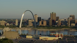 DX0001_000513 - 5.7K aerial stock footage of The Arch and skyline seen from across the Mississippi River at sunrise, Downtown St. Louis, Missouri